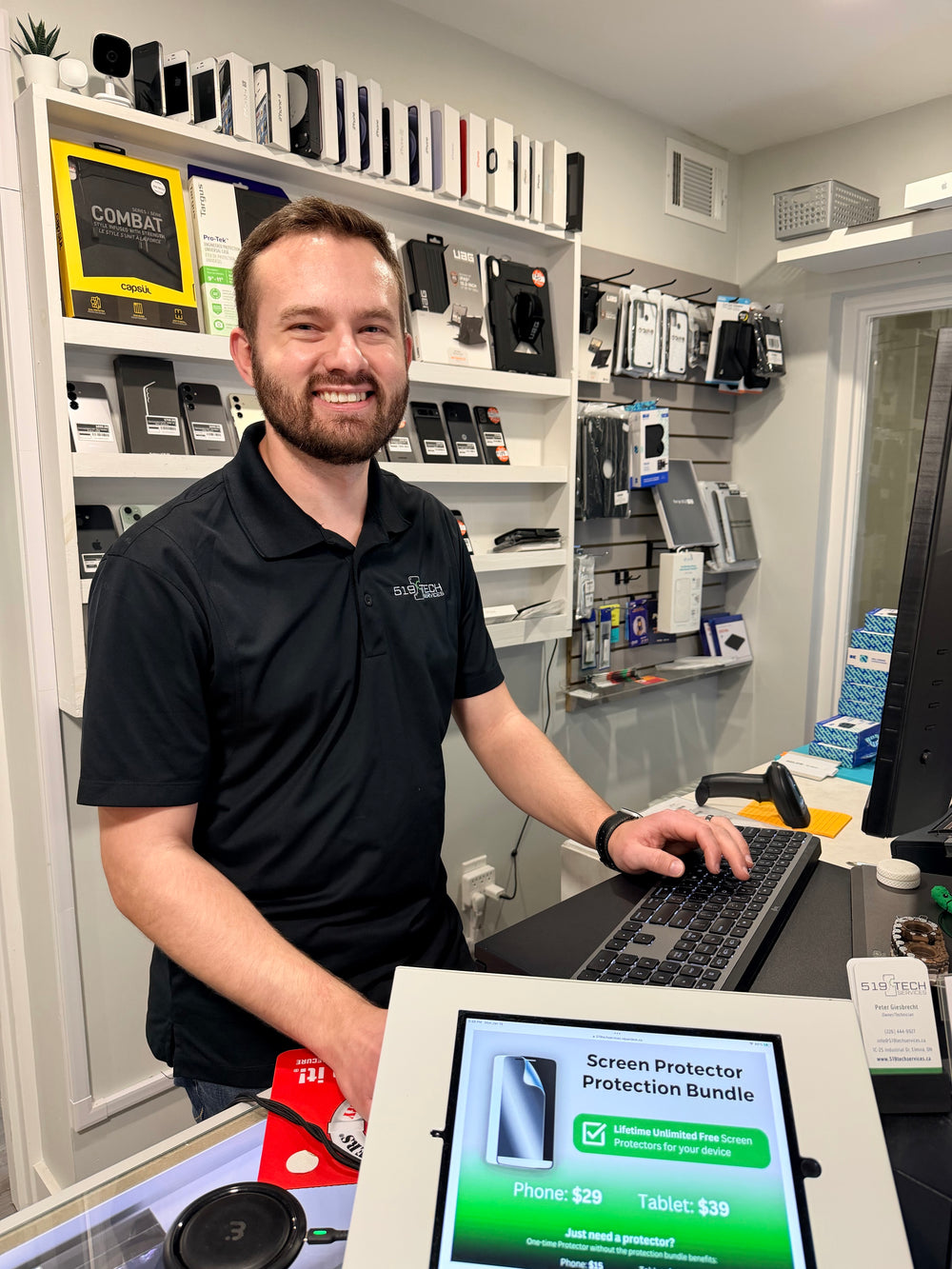 Peter at the counter in the 519 Tech Services shop in Elmira